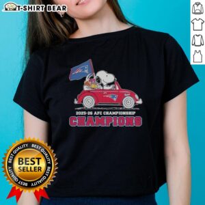 Snoopy and Woodstock celebrate on a New England Patriots car, showcasing the 2025-26 AFC Championship Champions ladies tee.