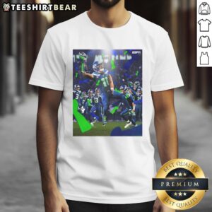 Jaxon Smith-Njigba wearing Seattle Seahawks Super Bowl LX Champions 2026 victory t-shirt, celebrating team's win.