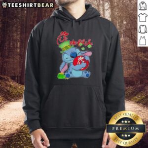 Alt Text: Cute Stitch wearing a St. Patrick's hoodie with Chick-fil-A logo, perfect for festive celebrations and fans.