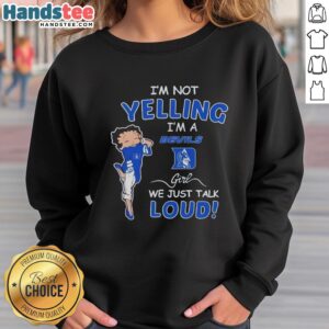 Girl wearing a Duke Blue Devils sweatshirt with 'I'm Not Yelling, We Just Talk Loud' text, showcasing team spirit.