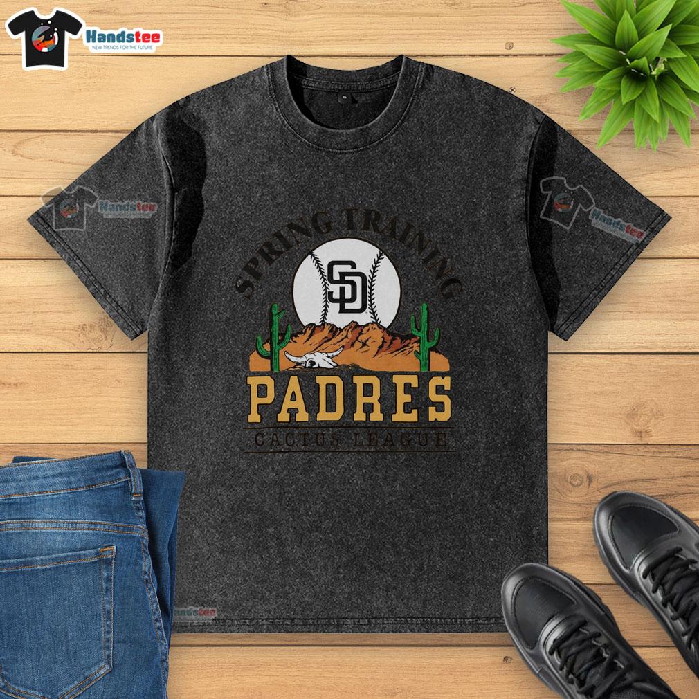 premium-san-diego-padres-cactus-league-desert-washed-t-shirt Alt Text: Premium San Diego Padres Cactus League Desert Washed T-Shirt displayed on a wooden background, showcasing its soft fabric and logo.