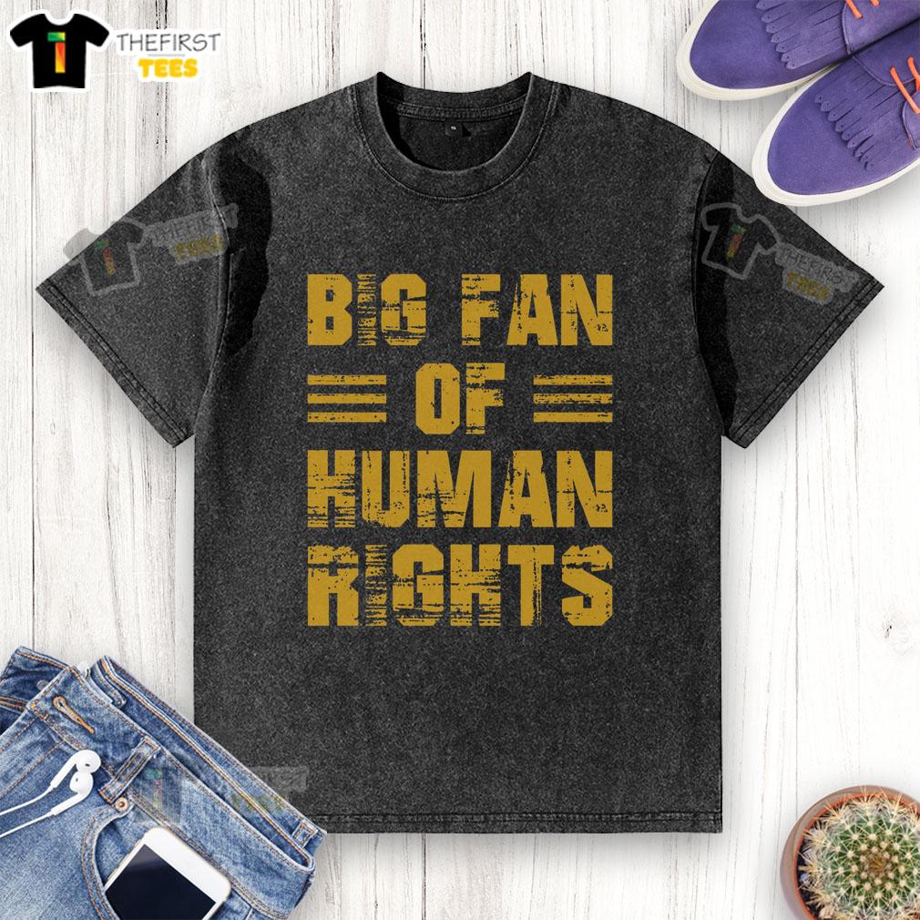 pretty-big-fan-of-human-rights-rights-advocate-washed-t-shirt Alt Text: Person wearing a washed t-shirt that says 'Pretty Big Fan of Human Rights' at a rights advocacy event.