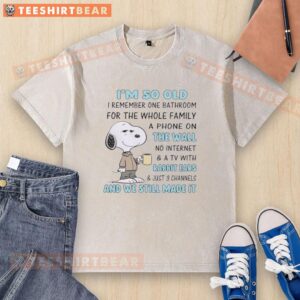 Snoopy graphic t-shirt reading 'I'm So Old I Remember One Bathroom for the Whole Family' with vintage phone design.