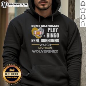Grandmas in Michigan Wolverines hoodies enjoy a game of bingo, showcasing their love for sports and family fun.