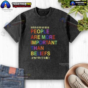 Stylish washed t-shirt with 'Hot People Are More Important Than Beliefs' slogan, perfect for casual and meaningful fashion.