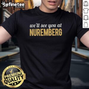 Top Anti Trump 'We'll See You At Nuremberg' T-Shirt featuring bold text on a stylish black background.