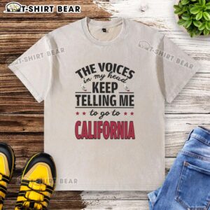 Official The Voices In My Head Keep Telling Me To Go To California washed t-shirt displayed on a wooden background.
