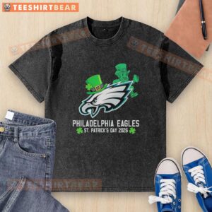 Official Philadelphia Eagles Football X St. Patrick's Day 2026 washed t-shirt featuring green design and team logo.