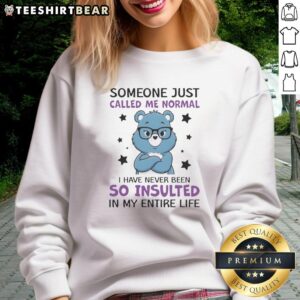 Awesome blue bear sweatshirt with 'Someone just called me Normali' text, showcasing humor and style in casual wear.