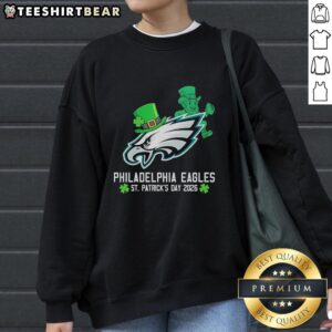 Official Philadelphia Eagles Football X St. Patrick's Day 2026 Sweatshirt featuring festive green design and team logo.