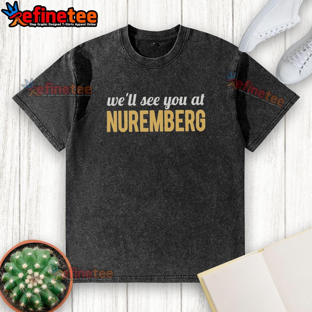 top-anti-trump-well-see-you-at-nuremberg-washed-t-shirt Top anti-Trump 'We'll See You At Nuremberg' washed t-shirt featuring bold text, perfect for political activism.