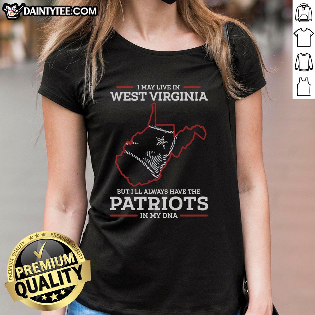 top-i-may-live-in-west-virginia-but-ill-always-have-the-new-england-patriots-in-my-dna-ladies-tee Lady wearing 'I May Live In West Virginia But Ill Always Have The New England Patriots In My DNA' tee, showcasing team pride.