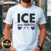 Alt Text: Top Ice Are Heroes Flag T-Shirt featuring a bold graphic design of a flag, perfect for patriotic fans and casual wear.