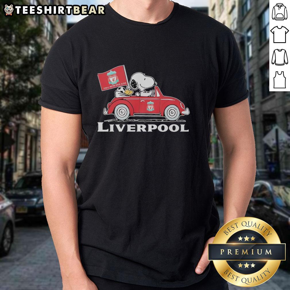 top-snoopy-and-woodstock-driving-liverpool-fc-red-car-raise-a-flag-t-shirt Snoopy and Woodstock in a Liverpool FC red car, raising a flag on a fun t-shirt design for fans.