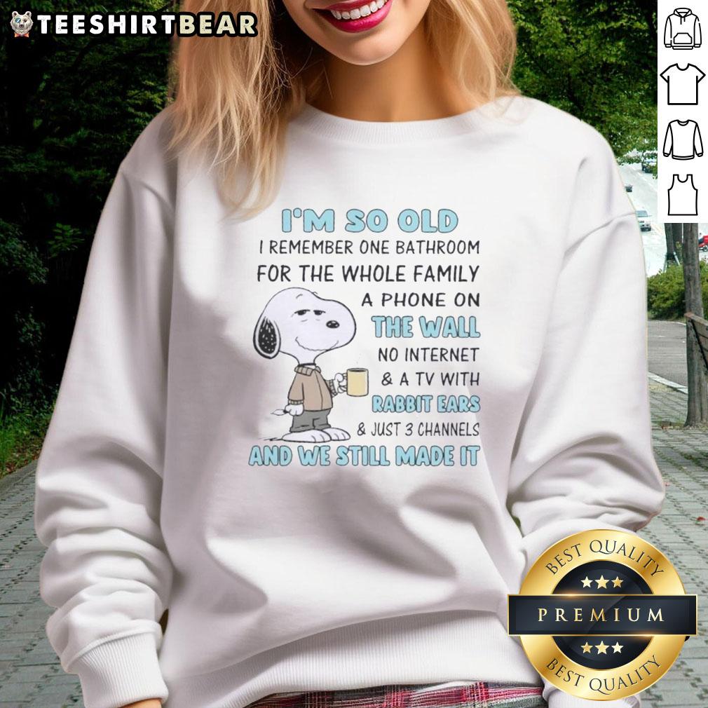 top-snoopy-im-so-old-i-remember-one-bathroom-for-the-whole-family-a-phone-on-the-wall-no-internet-sweatshirt Cozy sweatshirt featuring Snoopy with the phrase 'I'm so old, I remember one bathroom for the whole family, a phone on the wall, no Internet.'