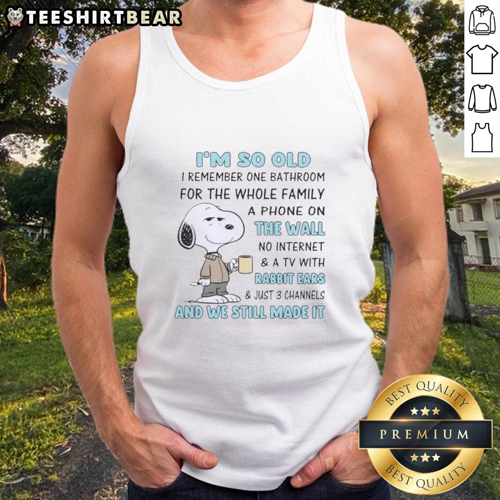 top-snoopy-im-so-old-i-remember-one-bathroom-for-the-whole-family-a-phone-on-the-wall-no-internet-tank-top Vintage Snoopy tank top design featuring nostalgic phrases about family life, one bathroom, and no internet.