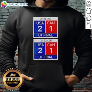Scoreboard showing USA 2 - Canada 1 in OT final 2026, featured on a hoodie celebrating American hockey.