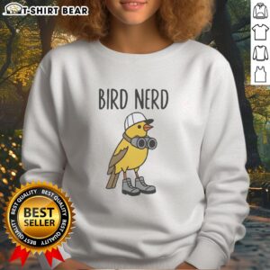 Nice bird nerd wearing shoes and binoculars sweatshirt, enjoying birdwatching in a sunny outdoor setting.