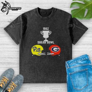 Alt Text: Vintage 1982 Sugar Bowl Pitt vs Georgia helmets trophy graphic on a washed t-shirt, perfect for football fans.
