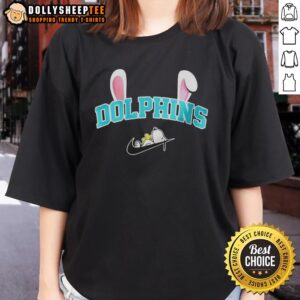 Official Miami Dolphins X Snoopy Happy Easter Ladies Tee featuring vibrant graphics and festive design for fans.