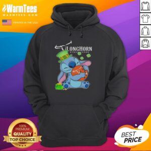 Alt Text: Cute Stitch hugging the Texas Longhorn Steakhouse logo on a Happy St. Patrick's Day hoodie.