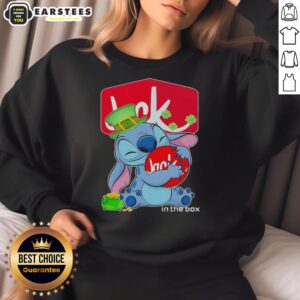 Cute Stitch hugging Jack in the Box logo on a Happy St. Patrick's Day sweatshirt, perfect for festive celebrations.