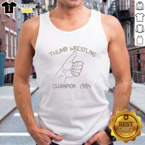 Alt Text: Artie Smalls wearing a tank top as the Top Thumb Wrestling Champion of 1984, showcasing his winning pose.