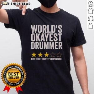 Alt Text: Original World's Okayest Drummer Hits Stuff Mostly On Purpose T-Shirt design featuring a humorous drummer graphic.