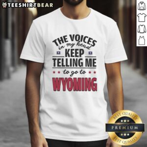 Funny 'The Voices In My Head Keep Telling Me To Go To Wyoming' T-shirt design with playful text and graphic illustration.