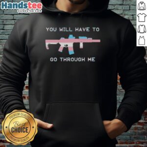 Official 'You Will Have To Go Through Me' Trans Gun Hoodie featuring bold text and vibrant colors for a striking statement.