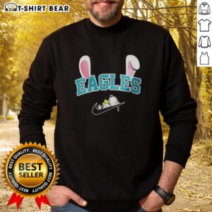 Alt Text: Pretty Philadelphia Eagles X Snoopy Happy Easter sweatshirt featuring colorful design and festive graphics.