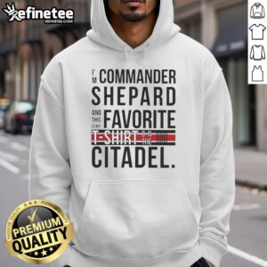 Alt Text: Commander Shepard wearing an 'Awesome I'm Commander Shepard and This Is My Favorite Shirt' hoodie on the Citadel.