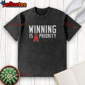 Original Los Angeles Angels 'Winning is Angels Priority' washed t-shirt featuring vibrant team colors and logo.