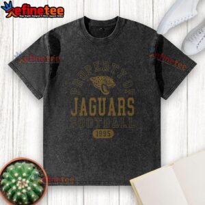 Alt Text: Premium Jacksonville Jaguars Football Property 1995 washed t-shirt featuring team logo and vintage design.