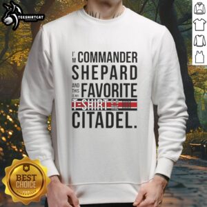 Alt Text: Commander Shepard wearing a favorite Citadel sweatshirt, showcasing gaming culture and Mass Effect fandom.