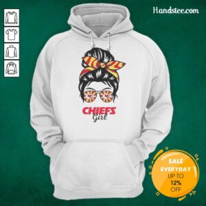Cheerful Kansas City Chiefs girl in a messy bun, glasses, and hoodie, showcasing team spirit and style.