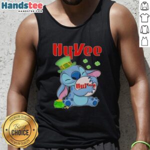 Alt Text: Cute Stitch hugging Hy-Vee logo on a St. Patrick's Day tank top, perfect for festive celebrations and casual wear.