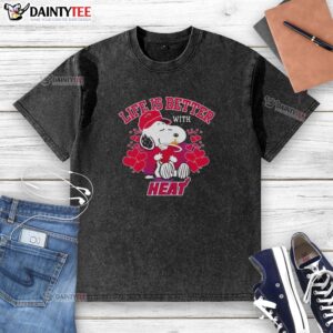 Alt Text: Awesome Snoopy holding Miami Heat logo on a Life is Better With Heat washed t-shirt, perfect for fans.