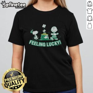 Alt Text: Official Peanuts Snoopy Feeling Lucky ladies tee featuring a playful Snoopy graphic on a stylish women's shirt.