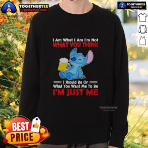 Nice Stitch holding a beer mug in 'I Am What I Am' sweatshirt, showcasing fun and individuality in casual fashion.