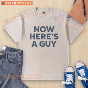Casual man wearing a blue text washed t-shirt with the phrase 'Good Now Heres A Guy' displayed prominently.