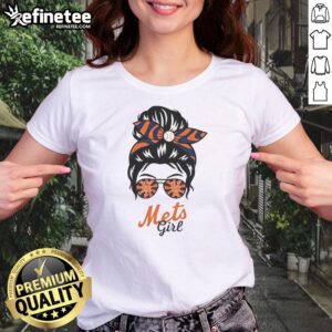 Official New York Mets girl in messy bun and glasses wearing a stylish ladies tee, showcasing team spirit.