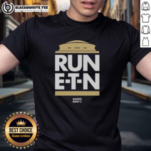 Top Run E-T-N Saints Now T-Shirt featuring bold graphics, perfect for New Orleans Saints fans and game day attire.