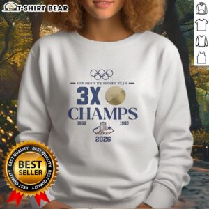 Men's ice hockey sweatshirt celebrating Top USA Hockey 2026 Olympic 3x Champions, featuring bold graphics and colors.