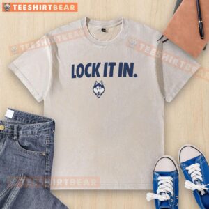 Official UConn Huskies 2026 Lock It In Washed T-Shirt featuring vibrant team colors and logo for fans.