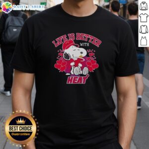 Alt Text: Snoopy holding Miami Heat logo on a stylish 'Life Is Better With Heat' T-shirt, perfect for Heat fans.