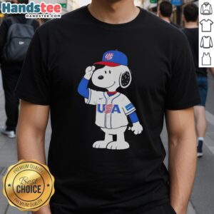 Nice Snoopy USA baseball jersey salute graphic T-shirt featuring Snoopy in a patriotic design celebrating American baseball.