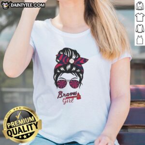 Atlanta Braves girl in a messy bun and glasses wearing a stylish ladies tee, showcasing team spirit and casual style.