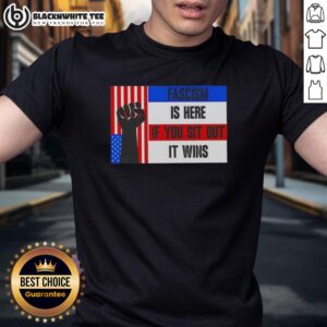 Official Fascism Is Here If You Sit Out It Wins T-Shirt featuring bold text on a stylish graphic tee.