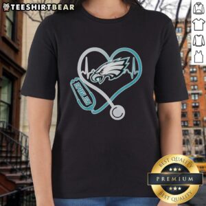 Top Nurse Heartbeat X Philadelphia Eagles Logo Ladies Tee showcasing a stylish design for Eagles fans and nurses.